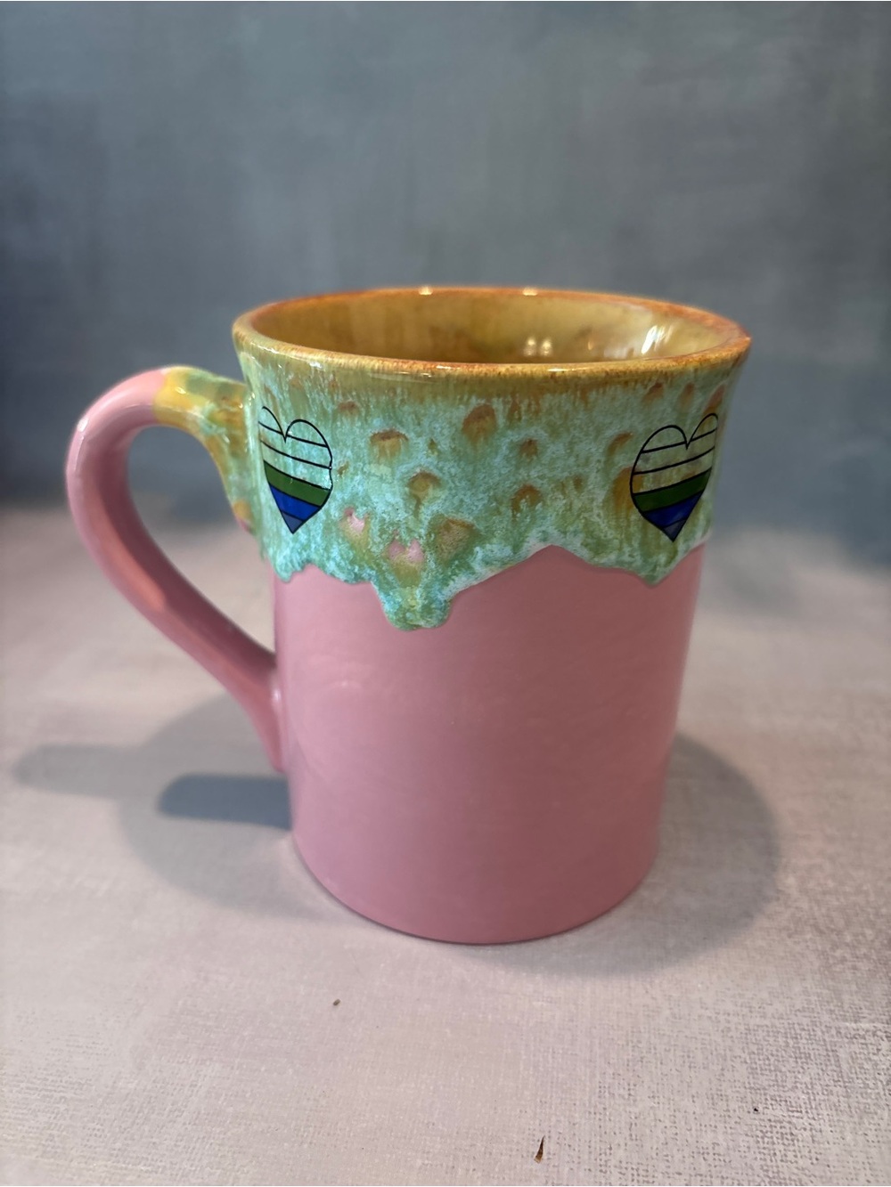 Handmade Pink Ceramic Mug with Green Drip Glaze and Heart Accents